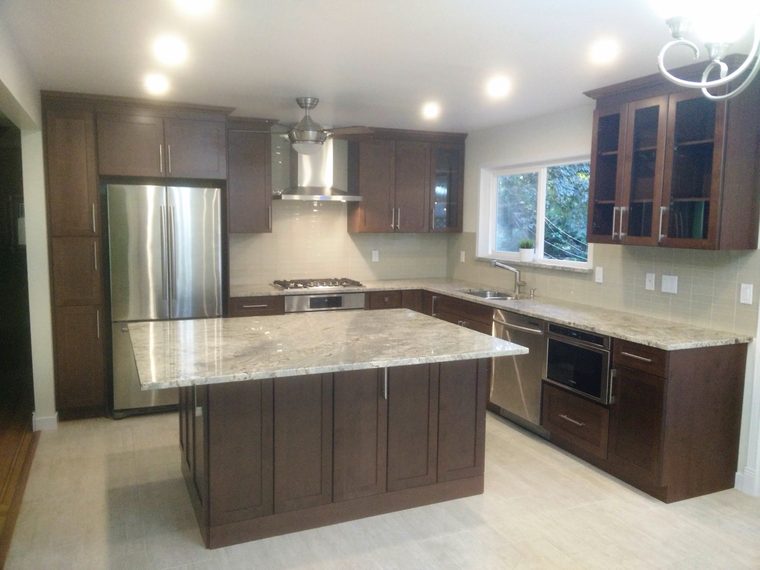 Renovated kitchen with a large island and stone counters
