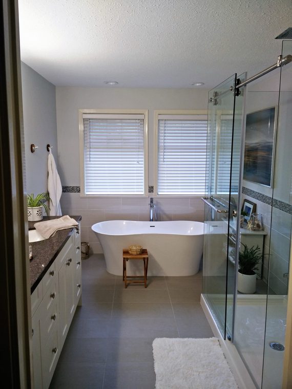 Renovated bathroom with a freestanding tub and glass shower