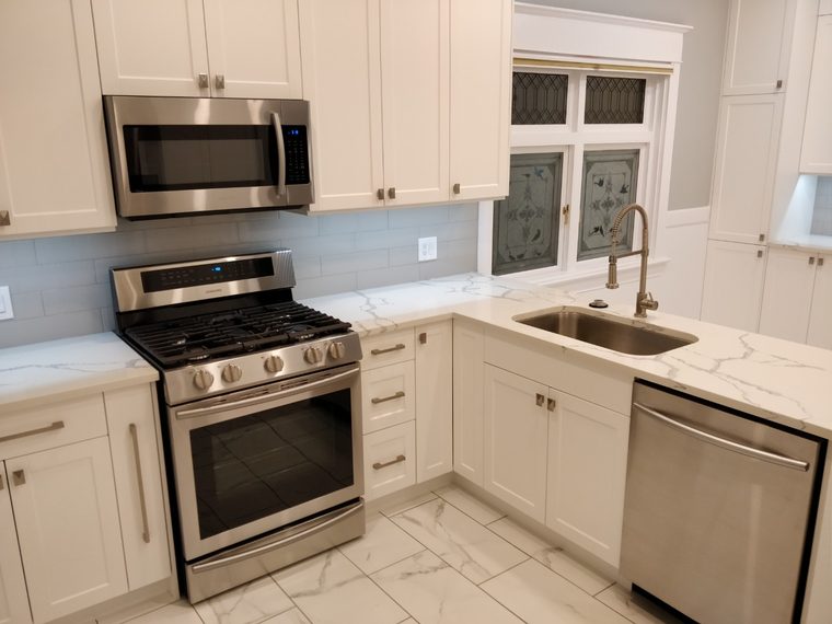Kitchen with a tiled backsplash and a stainless range